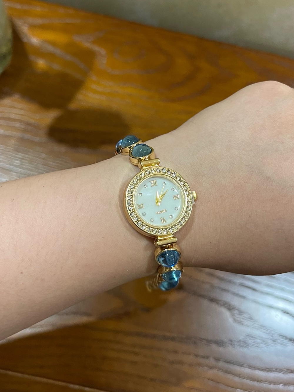Gold-Tone Women's Bracelet Watch with Blue Stone Accents - battery included